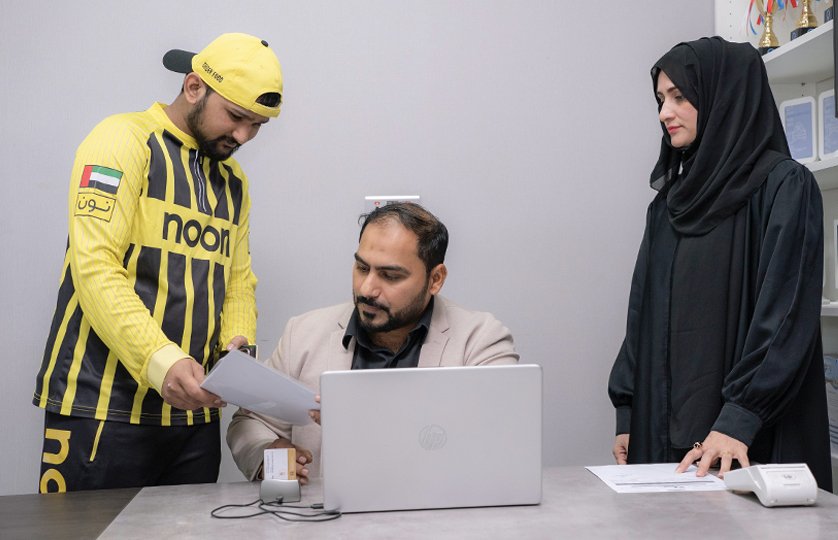 Emirates Way Delivery Services PRO Team Member is taking the rider details for Visa renewals