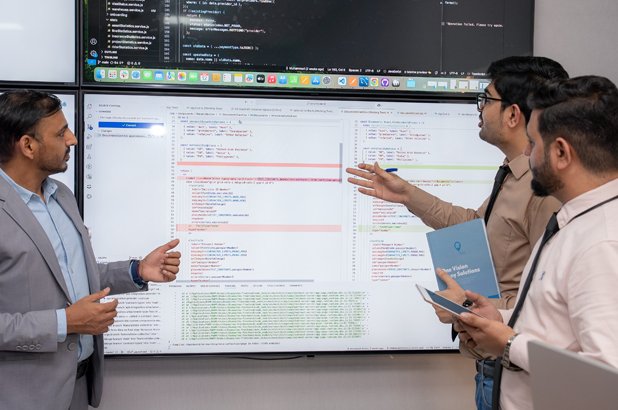 Emirates Way Delivery Services media and marketing team members while presenting their rider app in office