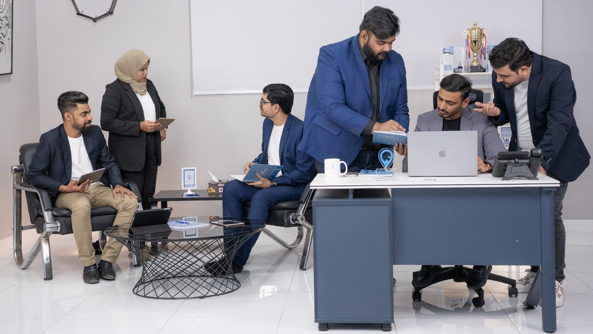 Emirates Way Delivery Services media and marketing team members while collaborating each other