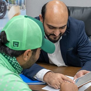 Emirates Way Delivery Services Operations Team Member Explaining Project Details to Careem Rider
