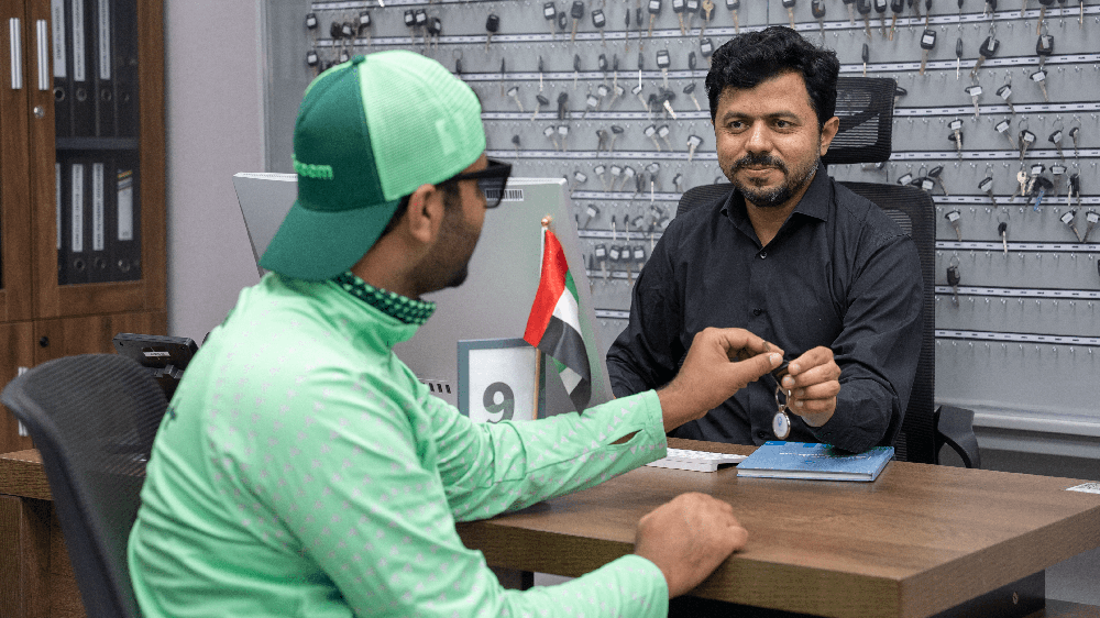 Emirates Way Delivery Services Operation team member presenting motorbike Key to Careem rider